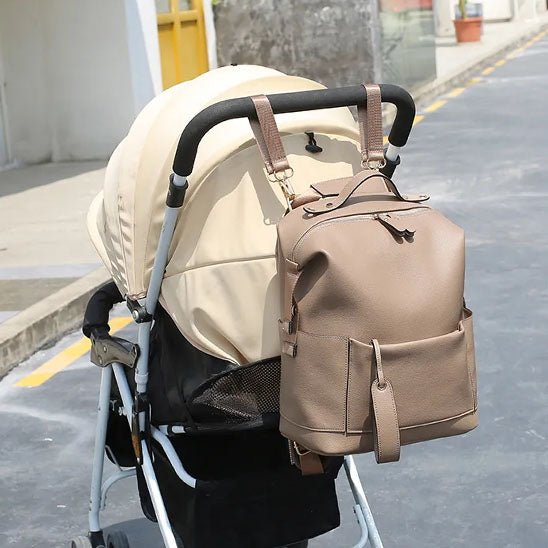 sac a dos a langer en cuir design sangles poussette